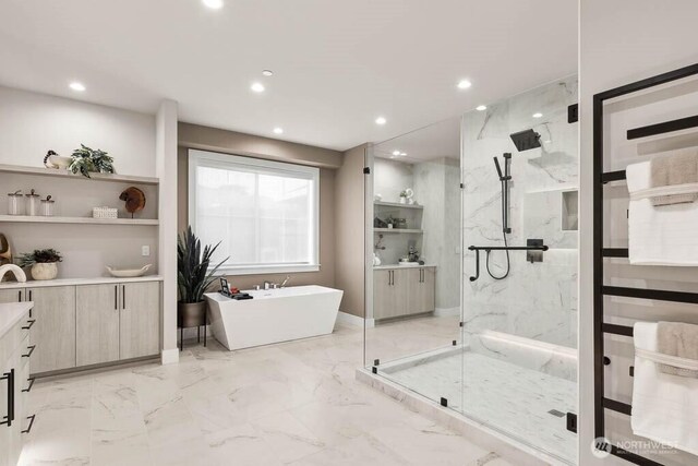 215 8th Ave W, Kirkland, WA 98033 - full bathroom featuring vanity, a marble finish shower, a freestanding tub, marble finish flooring, and recessed lighting