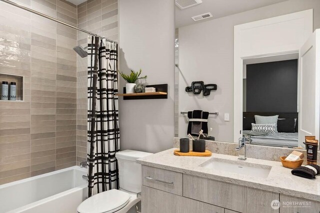 215 8th Ave W, Kirkland, WA 98033 - bathroom with toilet, shower / bathtub combination with curtain, and vanity