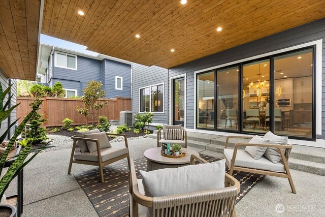 215 8th Ave W, Kirkland, WA 98033 - fenced backyard featuring a patio area, central AC unit, and an outdoor hangout area