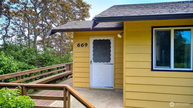 669 Marine Dr, Point Roberts, WA 98281 - entrance to property featuring roof with shingles and a balcony