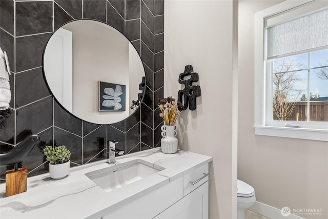 203 8th Ave W, Kirkland, WA 98033 - bathroom featuring vanity, toilet, tasteful backsplash, and baseboards