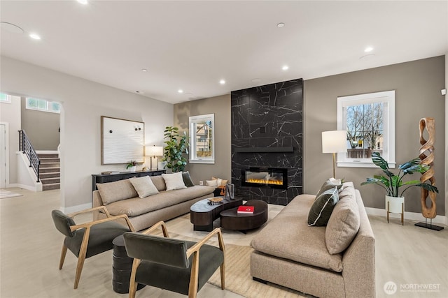 203 8th Ave W, Kirkland, WA 98033 - living area with recessed lighting, stairs, a premium fireplace, baseboards, and wood finished floors