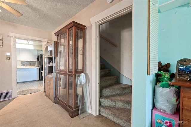 870 S 68th St, Tacoma, WA 98408 - stairway with carpet flooring, a textured ceiling, and a ceiling fan