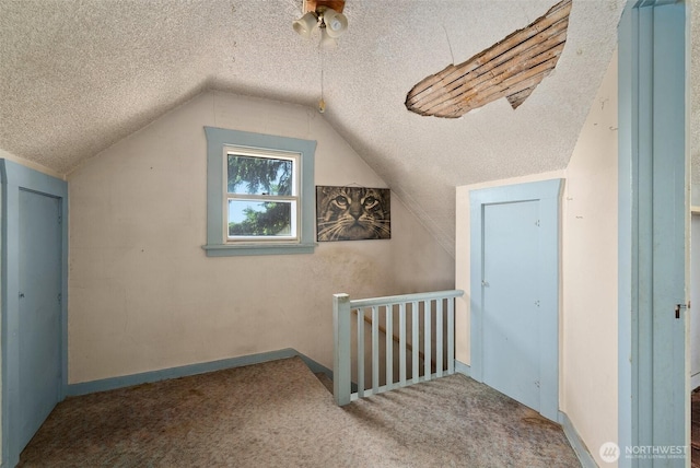 870 S 68th St, Tacoma, WA 98408 - bonus room with a textured ceiling, carpet floors, lofted ceiling, and baseboards