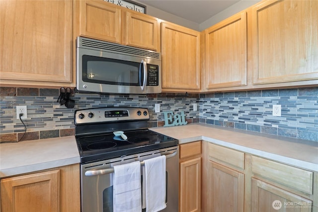 16574 Greenleaf Ave SE, Yelm, WA 98597 - kitchen with stainless steel appliances, light brown cabinetry, and light countertops