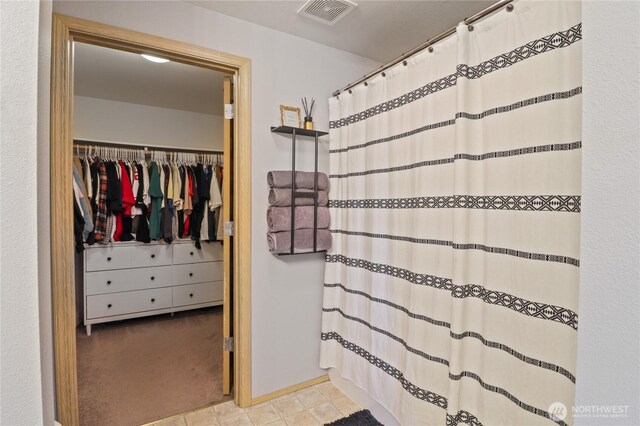 16574 Greenleaf Ave SE, Yelm, WA 98597 - bathroom with a spacious closet and curtained shower