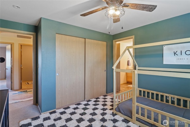 16574 Greenleaf Ave SE, Yelm, WA 98597 - carpeted bedroom with a closet and a ceiling fan
