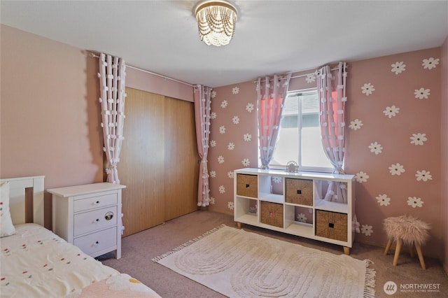 16574 Greenleaf Ave SE, Yelm, WA 98597 - bedroom with carpet, a closet, and wallpapered walls