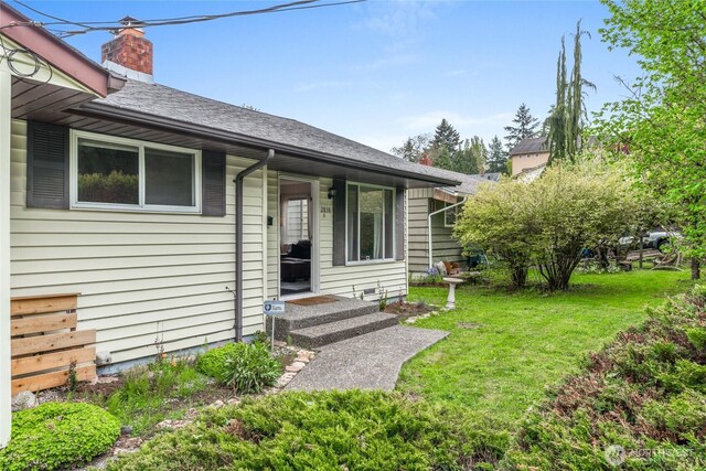 2838 SW 106th St, Seattle, WA 98146 - back of house featuring a lawn, a shingled roof, and a chimney