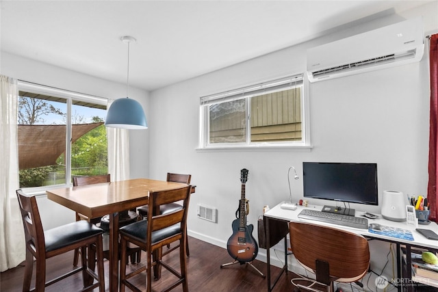 2838 SW 106th St, Seattle, WA 98146 - dining area with a wall mounted air conditioner, dark wood-style floors, and a desk