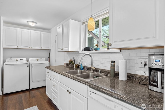 2838 SW 106th St, Seattle, WA 98146 - washroom featuring washer and clothes dryer, cabinet space, and dark wood-type flooring