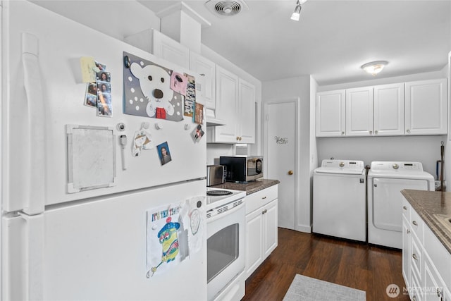 2838 SW 106th St, Seattle, WA 98146 - kitchen featuring white appliances, washer and dryer, white cabinetry, dark wood-style floors, and ventilation hood