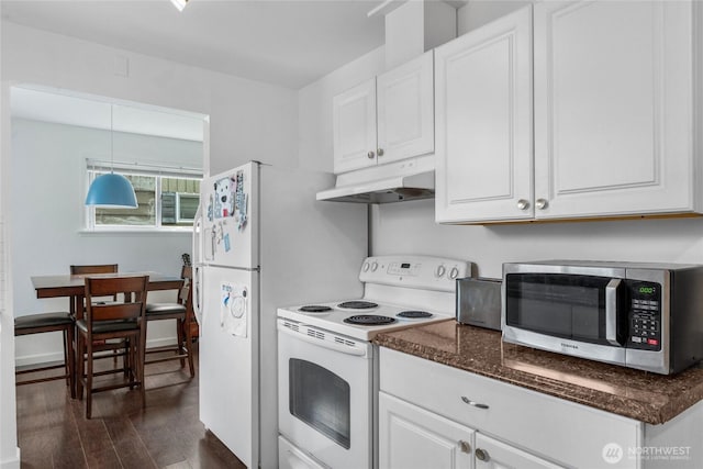 2838 SW 106th St, Seattle, WA 98146 - kitchen with under cabinet range hood, white appliances, dark wood-type flooring, white cabinetry, and dark stone countertops