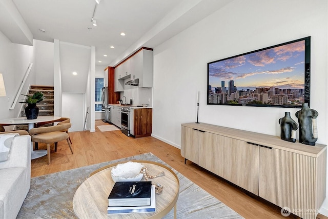 1225 E Roy St, Seattle, WA 98102 - living area featuring stairway, light wood-type flooring, track lighting, and recessed lighting