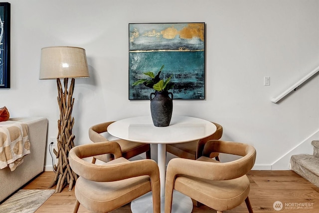 1225 E Roy St, Seattle, WA 98102 - dining space with stairway, wood finished floors, and baseboards