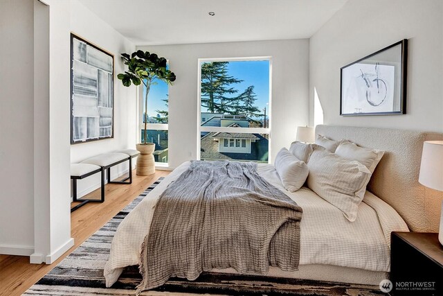 1225 E Roy St, Seattle, WA 98102 - bedroom featuring wood finished floors and baseboards
