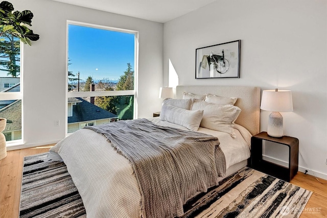 1225 E Roy St, Seattle, WA 98102 - bedroom featuring wood finished floors and baseboards