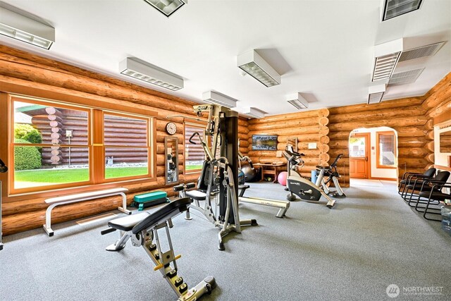 4751 Birch Bay Lynden Rd Unit 32, Blaine, WA 98230 - exercise area featuring log walls, plenty of natural light, and carpet flooring