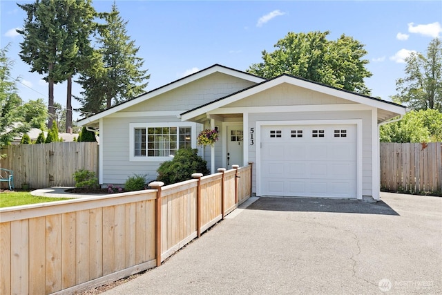 513 I St SW, Tumwater, WA 98512 - single story home with asphalt driveway and an attached garage