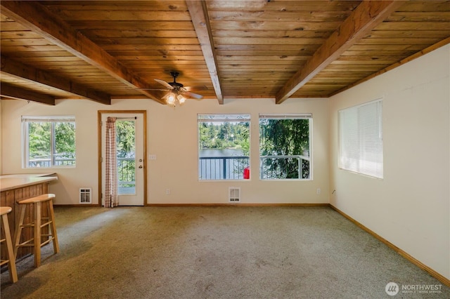 4662 SE Inwood Ln, Port Orchard, WA 98367 - unfurnished room featuring a ceiling fan, carpet floors, wood ceiling with exposed beams, baseboards, and heating unit