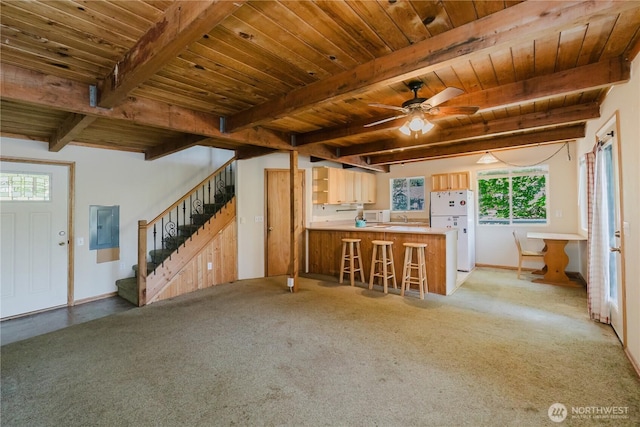 4662 SE Inwood Ln, Port Orchard, WA 98367 - kitchen featuring white appliances, electric panel, wooden ceiling with exposed beams, a peninsula, and ceiling fan