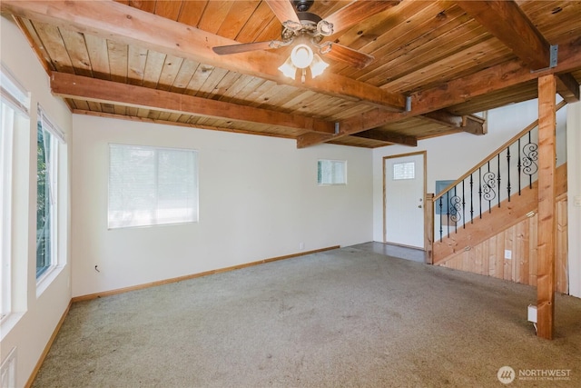4662 SE Inwood Ln, Port Orchard, WA 98367 - unfurnished living room with carpet floors, wooden ceiling with exposed beams, healthy amount of natural light, ceiling fan, and baseboards