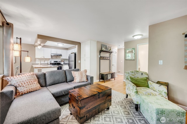 4231 NE 5th St Unit E101, Renton, WA 98059 - living area with light wood finished floors and baseboards