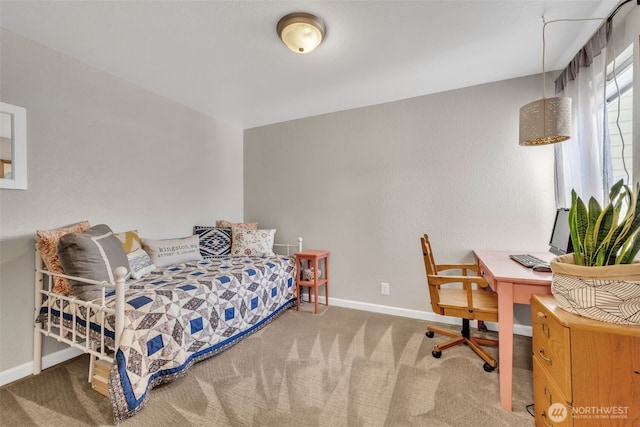 4231 NE 5th St Unit E101, Renton, WA 98059 - carpeted bedroom featuring baseboards and a desk