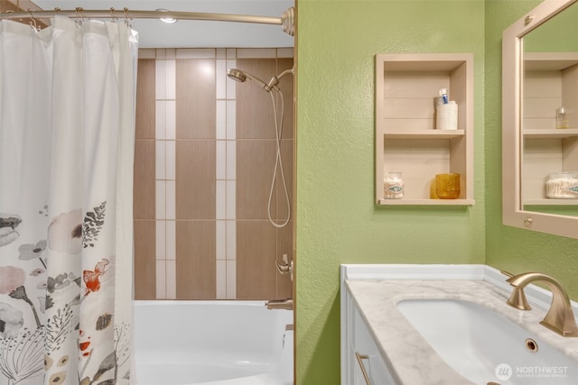 4231 NE 5th St Unit E101, Renton, WA 98059 - bathroom with a textured wall, vanity, and shower / bathtub combination with curtain
