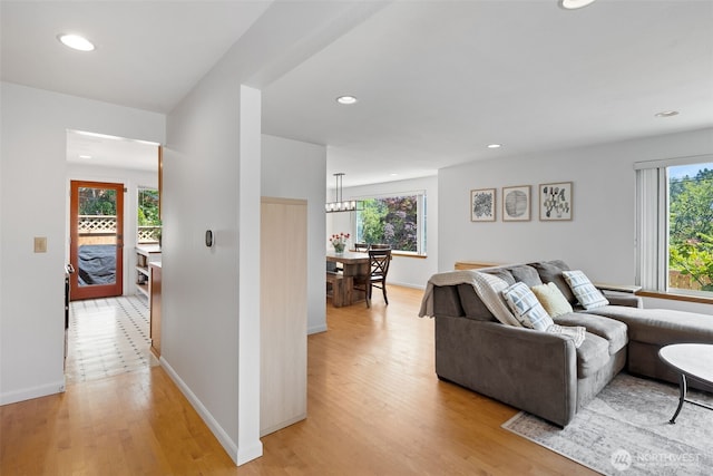 3435 34th Ave W, Seattle, WA 98199 - living room with light wood finished floors, healthy amount of natural light, recessed lighting, and baseboards