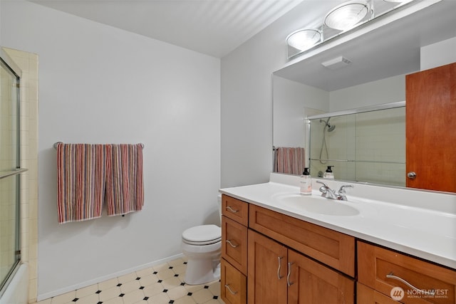 3435 34th Ave W, Seattle, WA 98199 - full bath featuring toilet, vanity, tile patterned floors, baseboards, and enclosed tub / shower combo