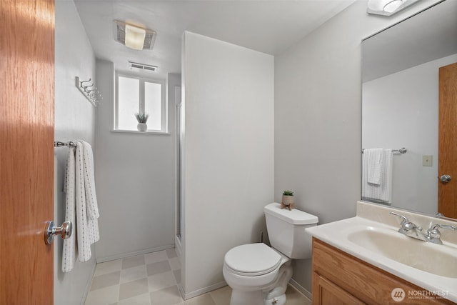 3435 34th Ave W, Seattle, WA 98199 - full bath featuring vanity, toilet, an enclosed shower, and tile patterned floors