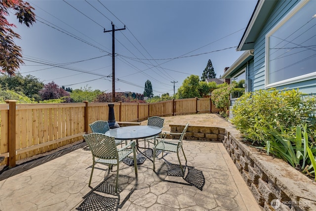 3435 34th Ave W, Seattle, WA 98199 - fenced backyard featuring outdoor dining space and a patio area