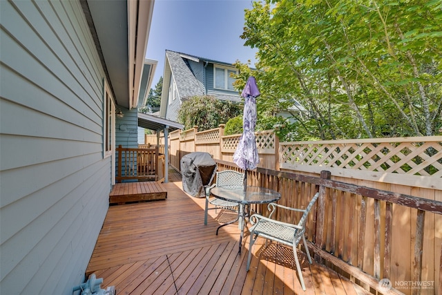 3435 34th Ave W, Seattle, WA 98199 - wooden terrace with outdoor dining space and a grill