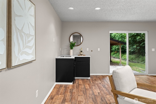 4562 SE Burley Olalla Rd, Olalla, WA 98359 - indoor wet bar with wood finished floors, a textured ceiling, baseboards, and recessed lighting