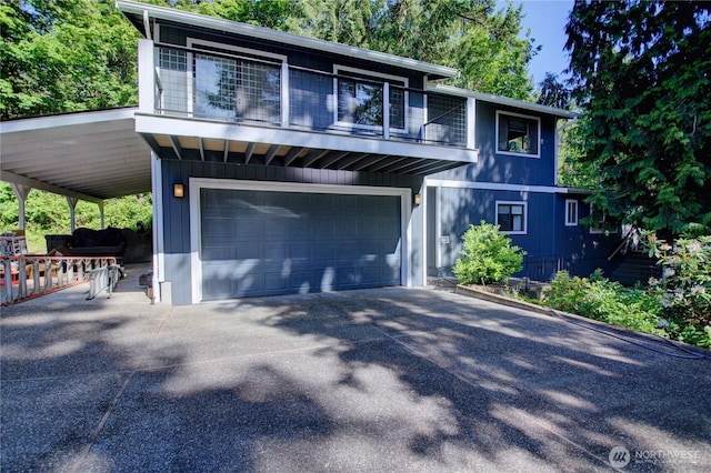 17147 Hope Island Ln, La Conner, WA 98257 - view of front of home featuring driveway, a balcony, and an attached garage
