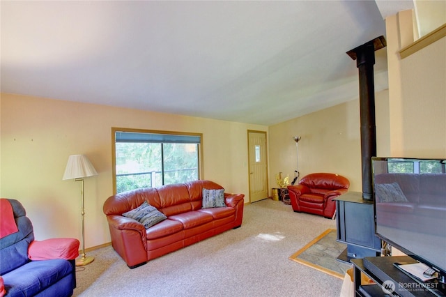 17147 Hope Island Ln, La Conner, WA 98257 - living room with carpet floors, a wood stove, and baseboards