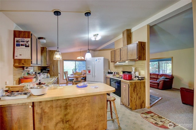 17147 Hope Island Ln, La Conner, WA 98257 - kitchen featuring white fridge with ice dispenser, vaulted ceiling, under cabinet range hood, electric stove, and a peninsula