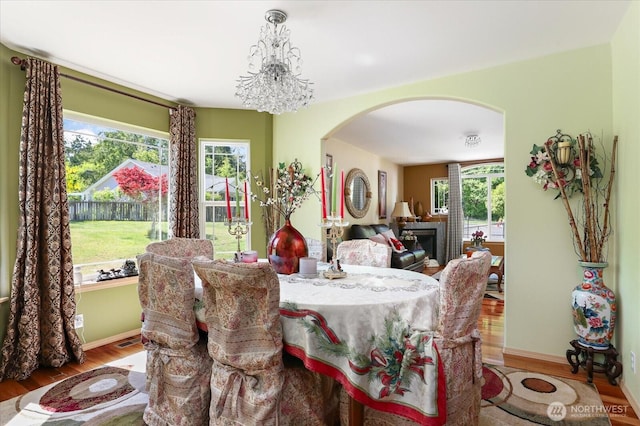 1440 Allyn Ln, Oak Harbor, WA 98277 - dining room with arched walkways, wood finished floors, healthy amount of natural light, and baseboards