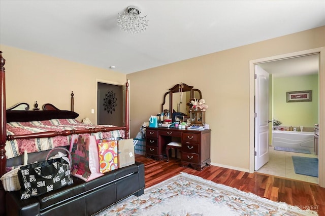 1440 Allyn Ln, Oak Harbor, WA 98277 - bedroom with wood finished floors, ensuite bath, and baseboards