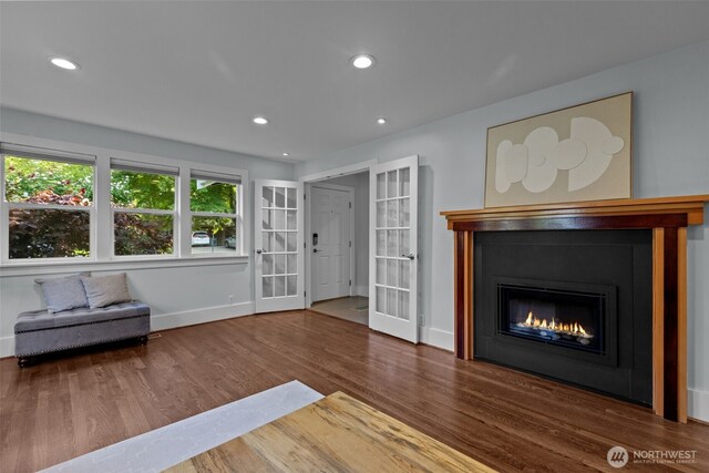 1716 N 125th St, Seattle, WA 98133 - living room featuring french doors, wood finished floors, a glass covered fireplace, and recessed lighting