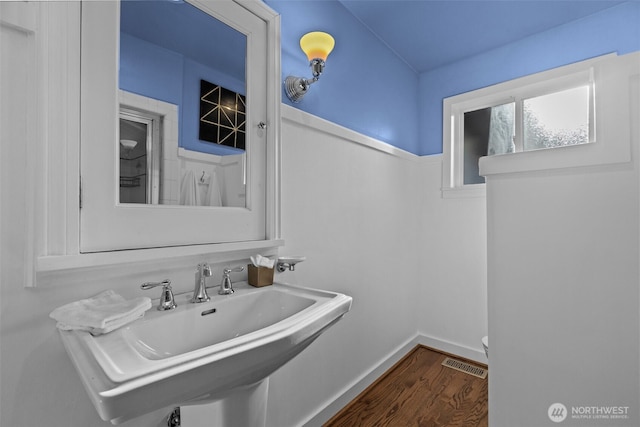 1716 N 125th St, Seattle, WA 98133 - half bathroom featuring wood finished floors and a sink