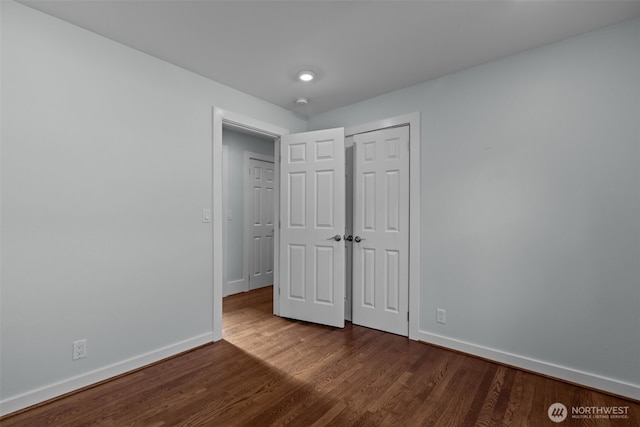 1716 N 125th St, Seattle, WA 98133 - unfurnished bedroom with dark wood-type flooring and a closet