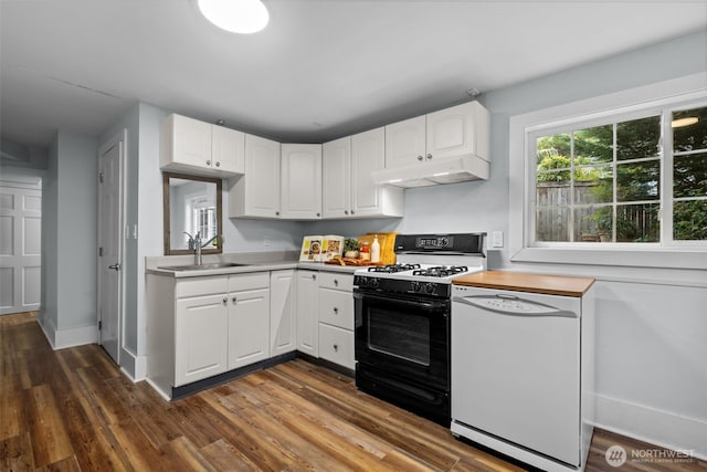 1716 N 125th St, Seattle, WA 98133 - kitchen with black gas range oven, white dishwasher, under cabinet range hood, dark wood-type flooring, and white cabinetry