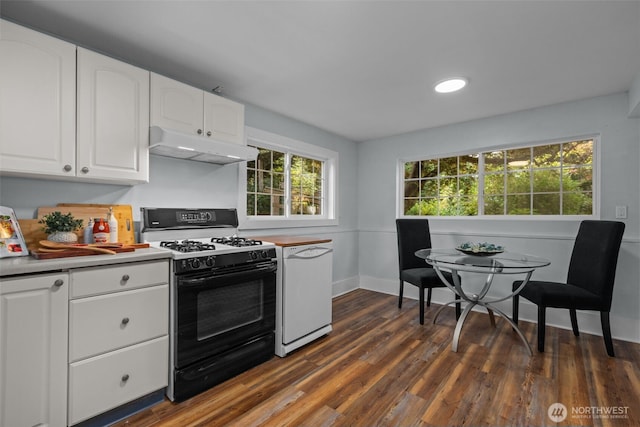 1716 N 125th St, Seattle, WA 98133 - kitchen with gas stove, under cabinet range hood, white cabinetry, dark wood finished floors, and light countertops