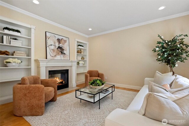 2315 35th Ct, Anacortes, WA 98221 - living room featuring a tile fireplace, wood finished floors, built in features, baseboards, and recessed lighting