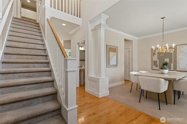 2315 35th Ct, Anacortes, WA 98221 - dining room with stairway, light wood finished floors, crown molding, decorative columns, and baseboards
