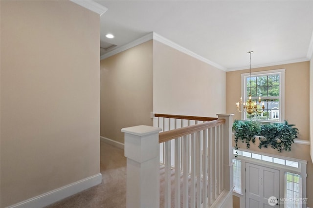 2315 35th Ct, Anacortes, WA 98221 - corridor featuring an upstairs landing, a chandelier, baseboards, ornamental molding, and light colored carpet