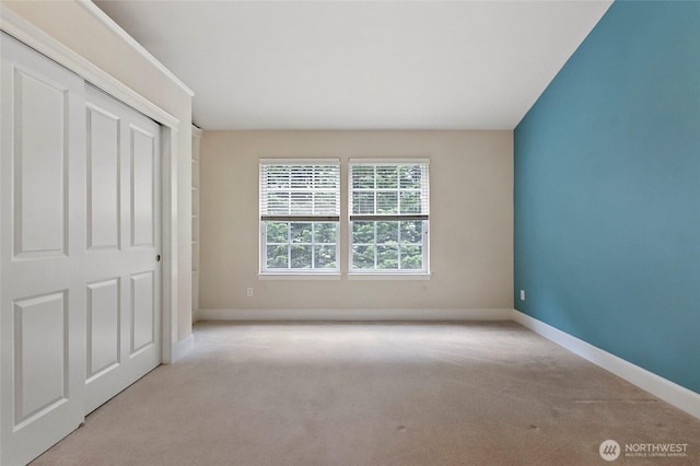 2315 35th Ct, Anacortes, WA 98221 - unfurnished bedroom with carpet, baseboards, and a closet