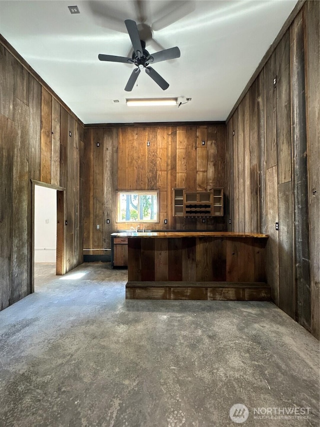164 Harkins Rd, Winlock, WA 98596 - bar with wood walls, a ceiling fan, and unfinished concrete floors
